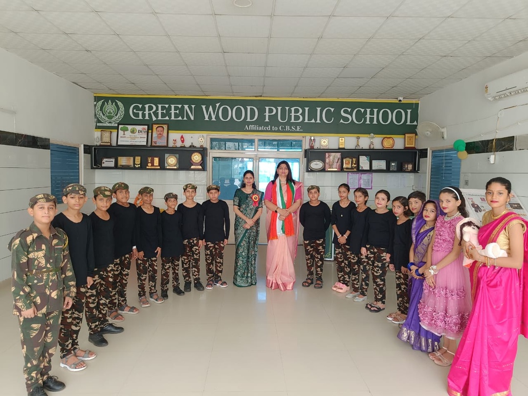 Students in drama and dance costumes celebrating school annual day