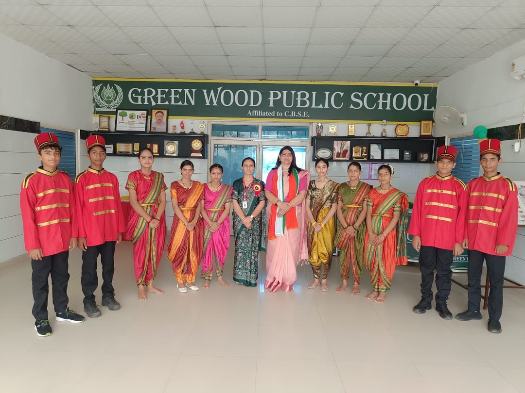 Greenwood Public School band in ceremonial uniforms beside students in traditional dress