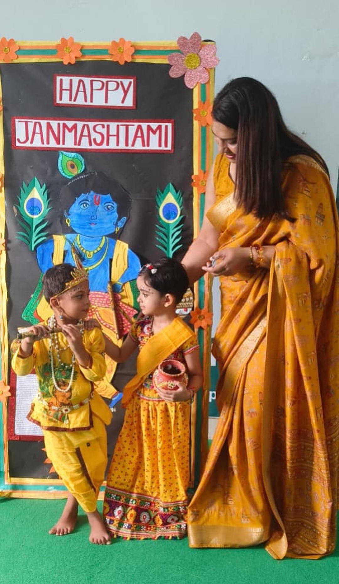 Primary children dressed up in traditional costumes receiving appreciation